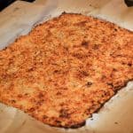 This Parmesan Cauliflower Pizza Crust is the secret to getting a perfectly crispy no-carb cauliflower crust! A healthy alternative to the usual pizza crust! #cauliflowerpizzacrust #lowcarbpizza #healthypizzacrust www.savoryexperiments.com