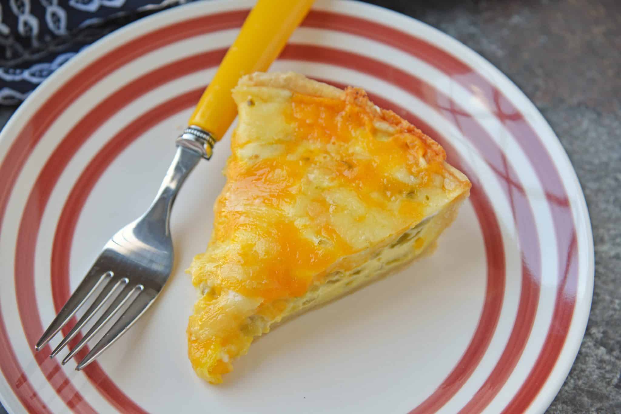 Slice of Chile Relleno Quiche on a striped red plate