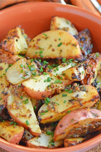 This Dijon Roasted Potatoes recipe is the perfect potato side dish to serve alongside chicken or steak! These oven roasted potatoes are packed full of flavor! #ovenroastedpotatoes #roastedpotatoesrecipe www.savoryexperiments.com