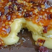 Apricot Cranberry Baked Brie is the ultimate appetizer. This baked brie appetizer will be perfect for any occasion. #bakedbrierecipe #bakedbrieappetizer www.savoryexperiments.com