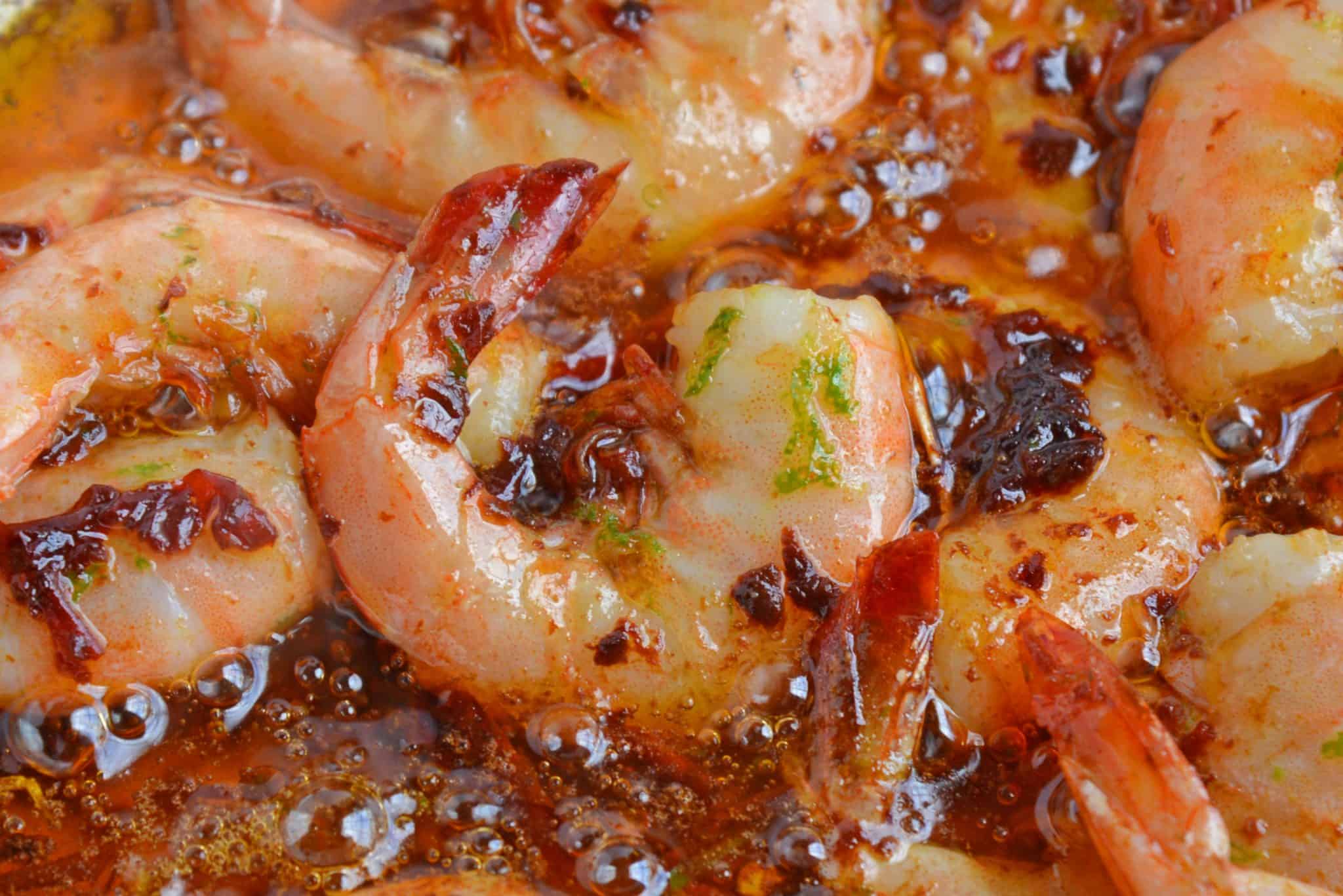 Chipotle Lime Buttered Shrimp is a delicious, spicy shrimp recipe! The chipotle peppers in adobe sauce with lime juice, make this recipe the perfect appetizer! #spicyshrimprecipe #sauteedshrimp www.savoryexperiments.com