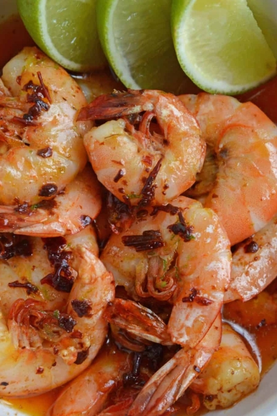 Chipotle Lime Buttered Shrimp is a delicious, spicy shrimp recipe! The chipotle peppers in adobo sauce with lime juice, make this recipe the perfect appetizer! #spicyshrimprecipe #sauteedshrimp www.savoryexperiments.com