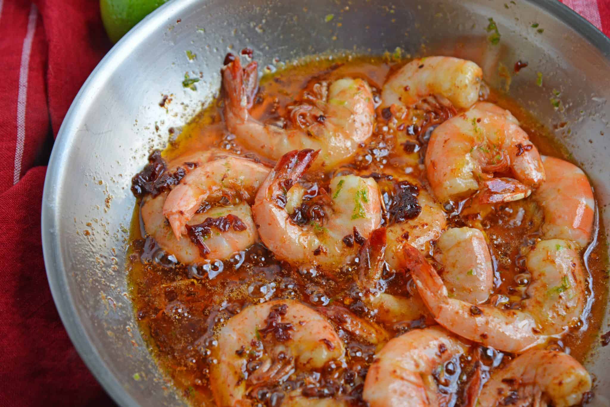 Chipotle Lime Buttered Shrimp is a delicious, spicy shrimp recipe! The chipotle peppers in adobo sauce with lime juice, make this recipe the perfect appetizer! #spicyshrimprecipe #sauteedshrimp www.savoryexperiments.com