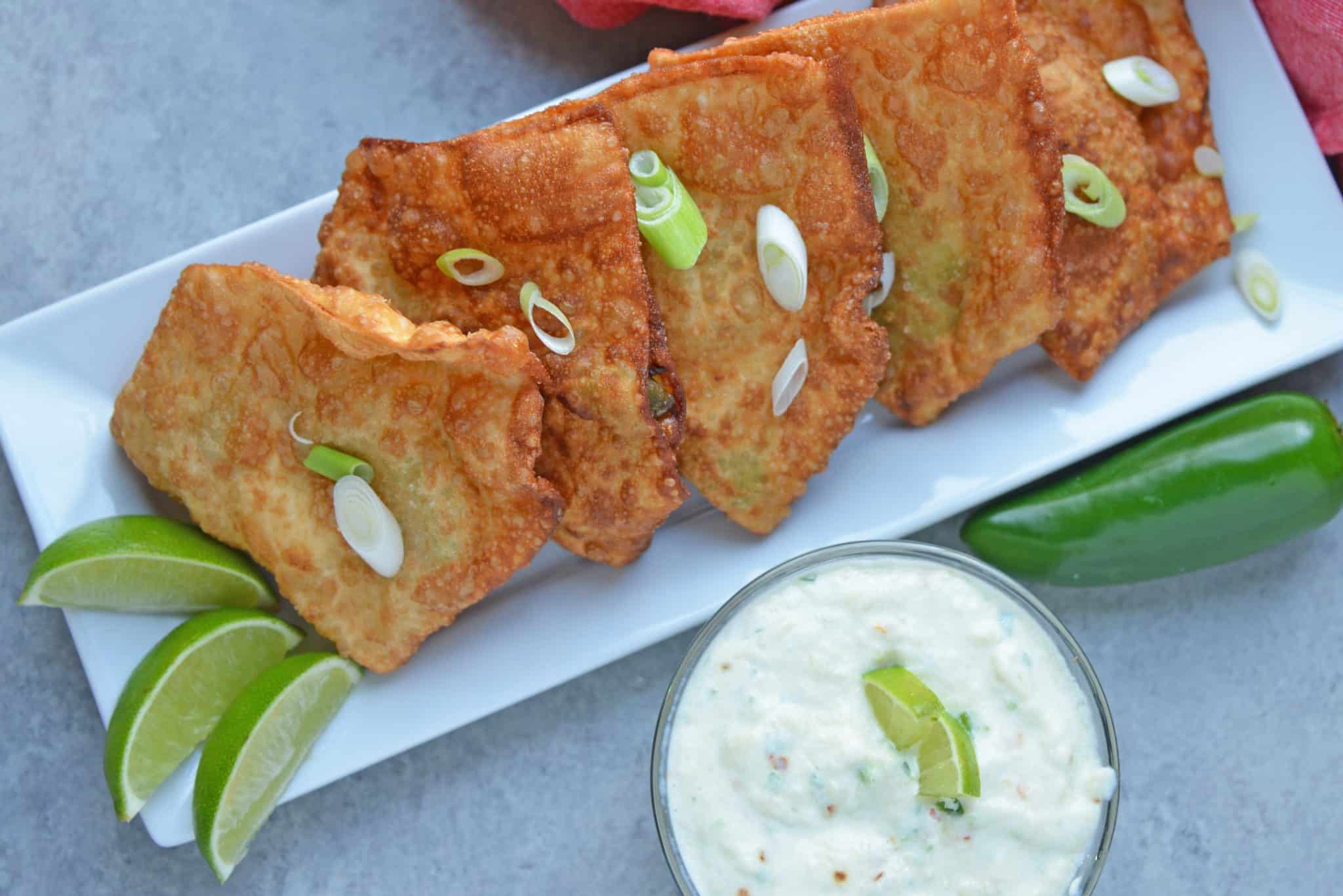 creamy pineapple dip with crispy crab rangoons and scallions 