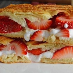 delicious dessert sandwich with croissant, fluff, fruit and dulce de leche