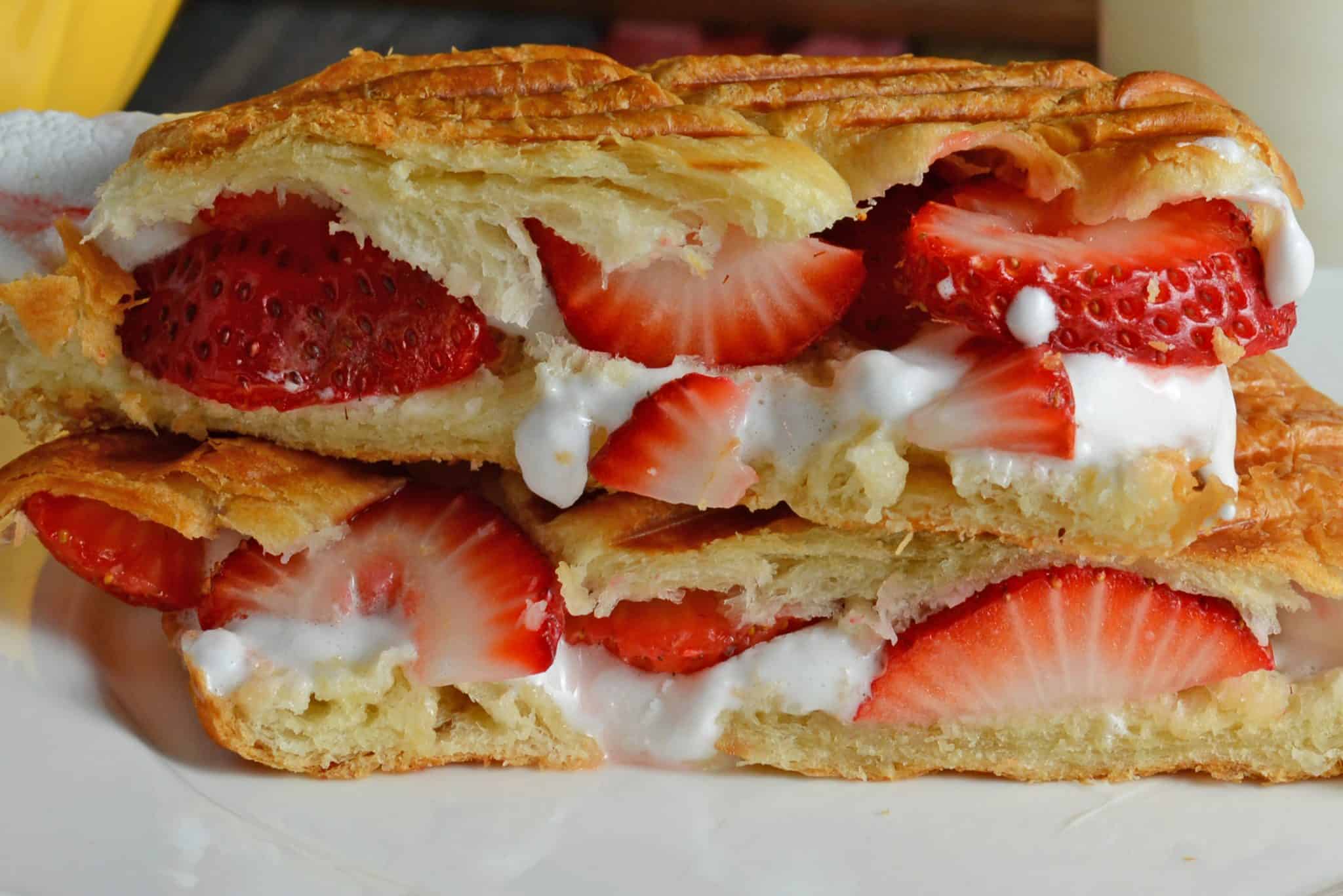 delicious dessert sandwich with croissant, fluff, fruit and dulce de leche