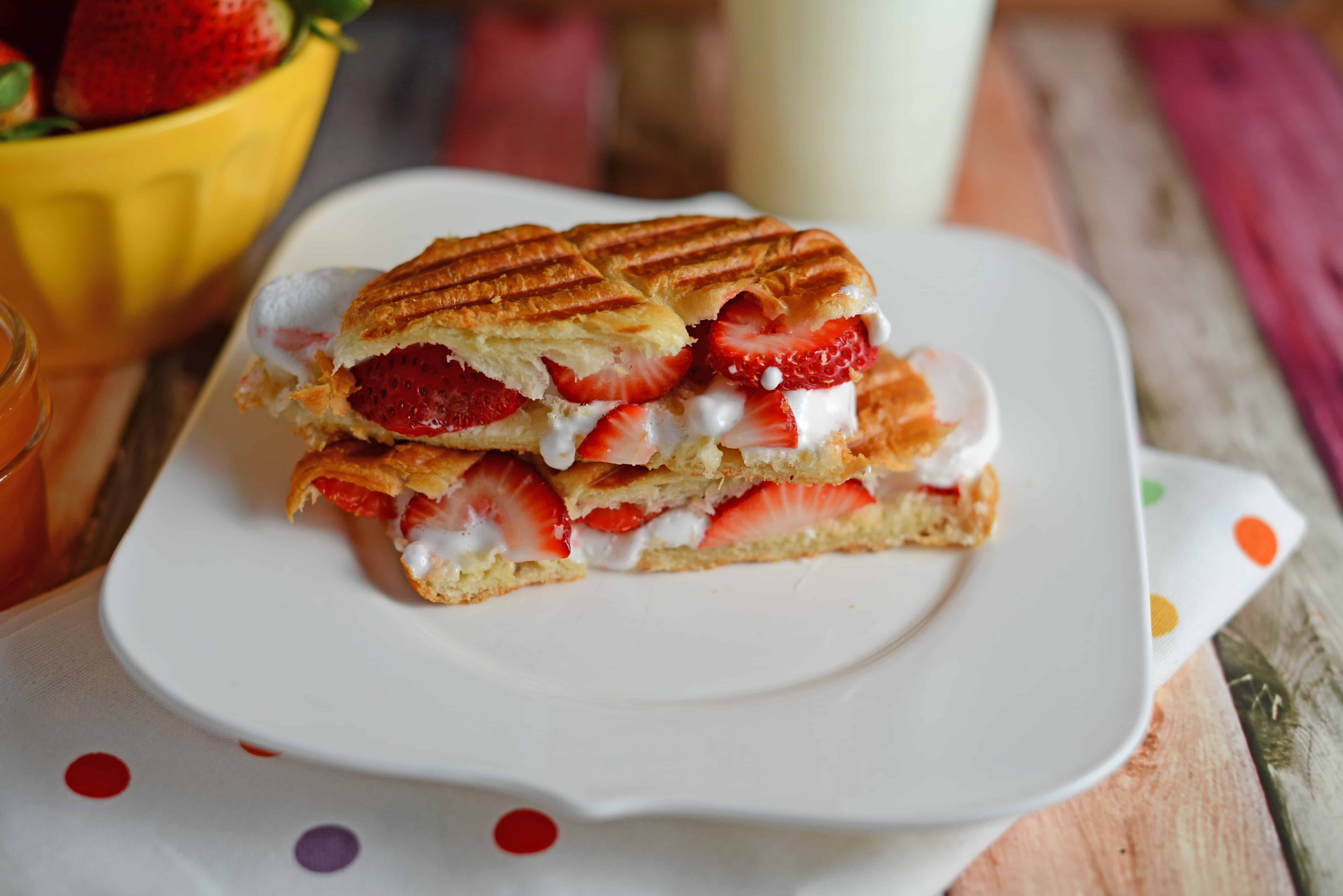 Dulce de Leche & Strawberry Croissant Panini- layers of decadent dulce de leche (or caramel), gooey marshmallow and freshly sliced berries all in a buttery croissant. This dessert only takes 10 minutes and is OH so good! www.savoryexperiments.com