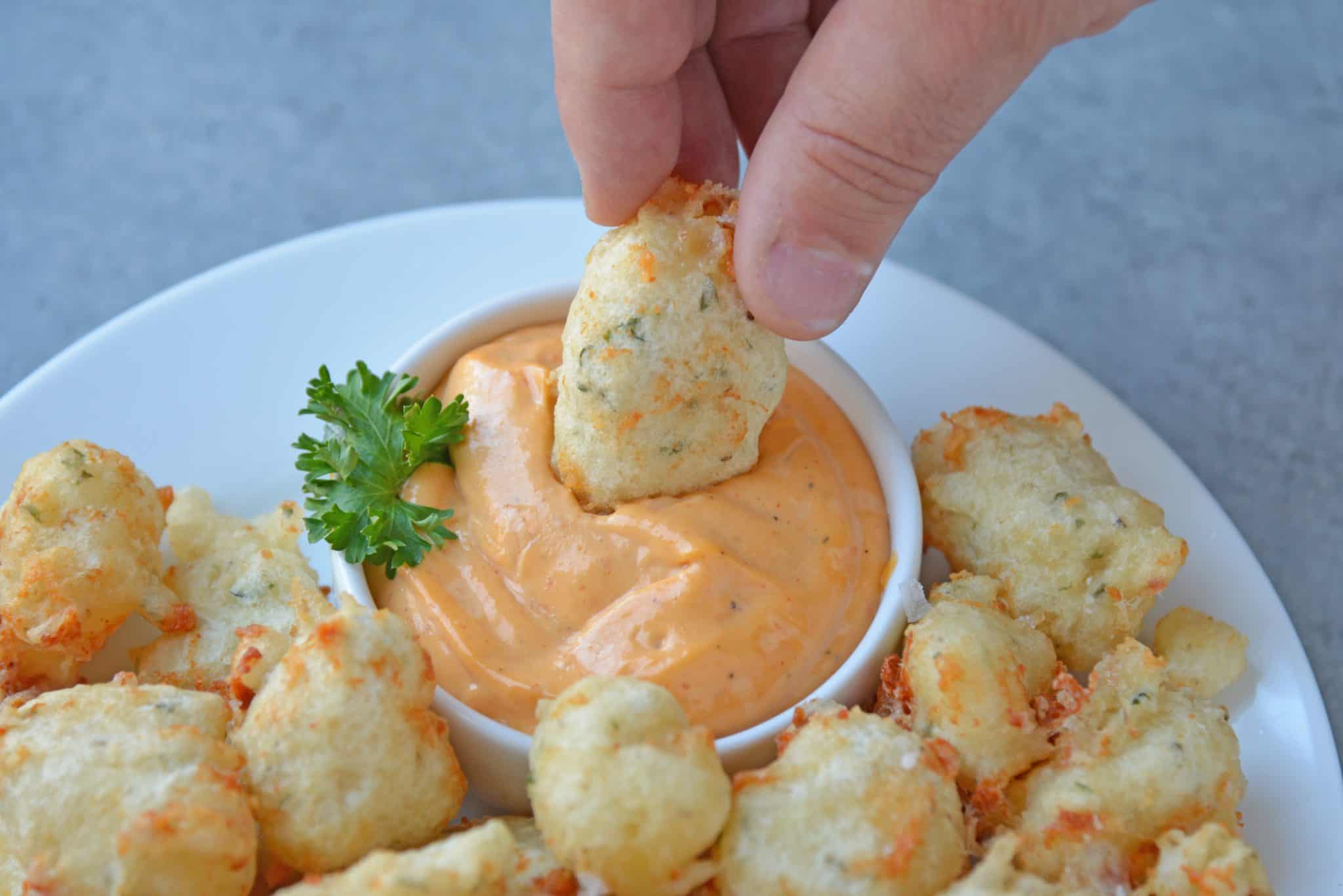 Fried Cheese Curds, also known as Beer Battered Cheese Curds, as the perfect fried cheese balls! Gooey little nuggets paired with a tangy dipping sauce. A great easy appetizer for snack idea! 