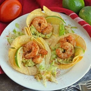 You will love this spicy Shrimp Tostadas recipe! The cooling sour cream and guacamole with the combination of the spicy shrimp is a mixture that you will love. #tostadarecipe #whatisatostada #shrimprecipes www.savoryexperiments.com
