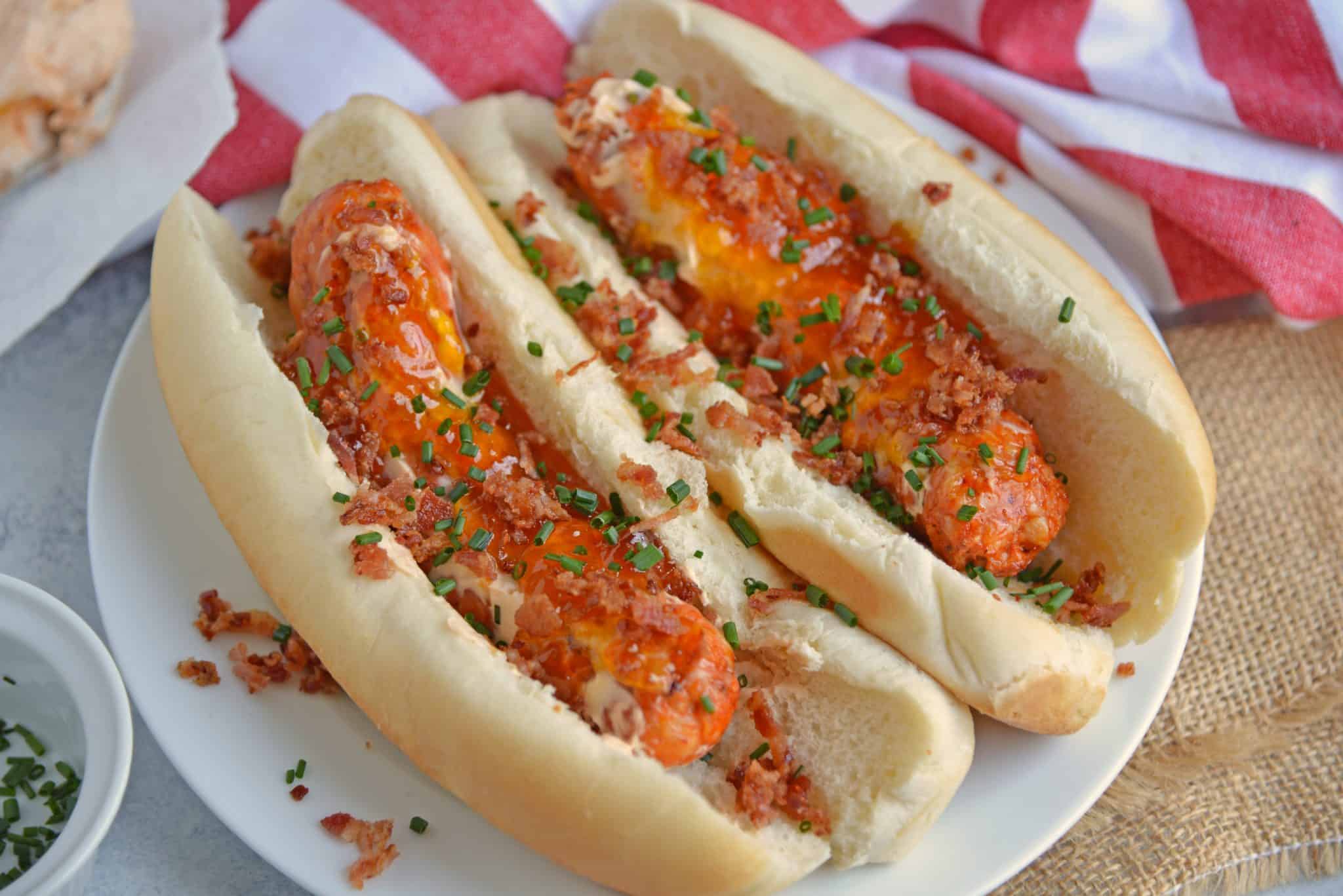 Sweet and Spicy Italian Sausage Sandwiches combine spicy Italian sausage with hot sauce spiked cream cheese with sweet apricot jam, salty bacon and chives. #sausagesandwiches www.savoryexperiments.com 