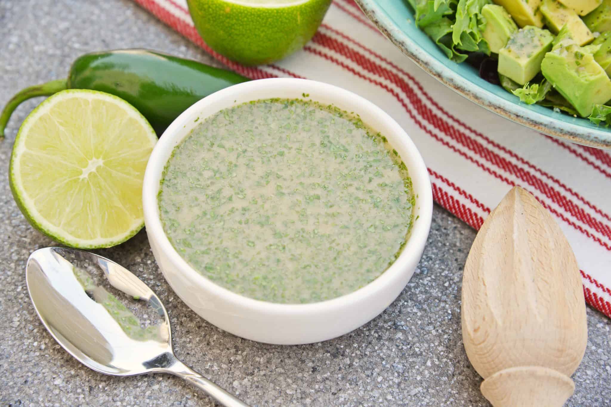 Cilantro Lime Dressing is an easy and delicious citrus dressing for salads, dipping sauces or even as a marinade! Spicy and sweet, it is no-cook and comes together in 5 minutes. #homemadesaladdressing www.savoryexperiments.com