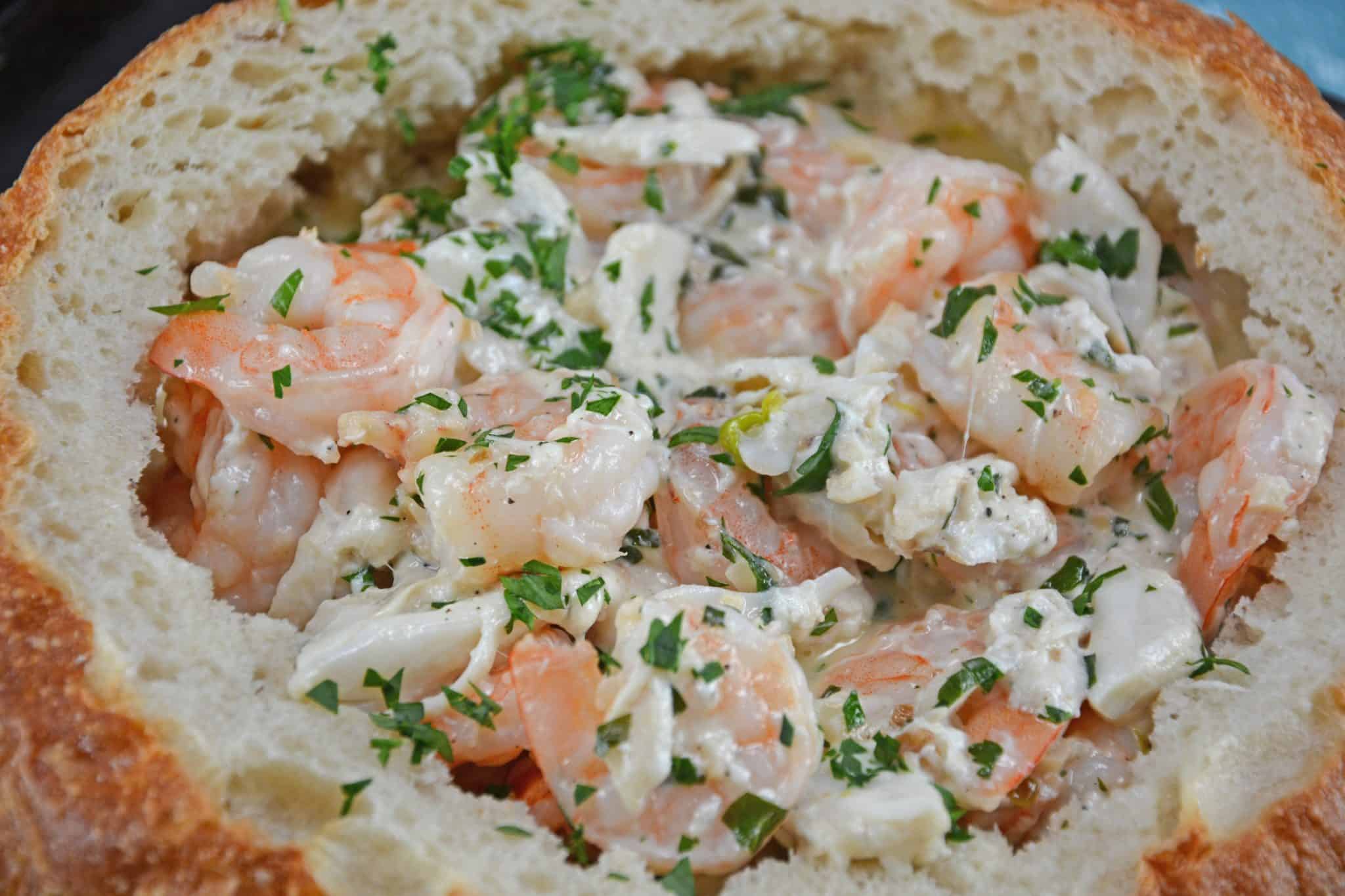 Creamy Shrimp Scampi Bread Bowl can be an easy appetizer or entree, dipping bread in the rich scampi sauce with succulent shrimp.