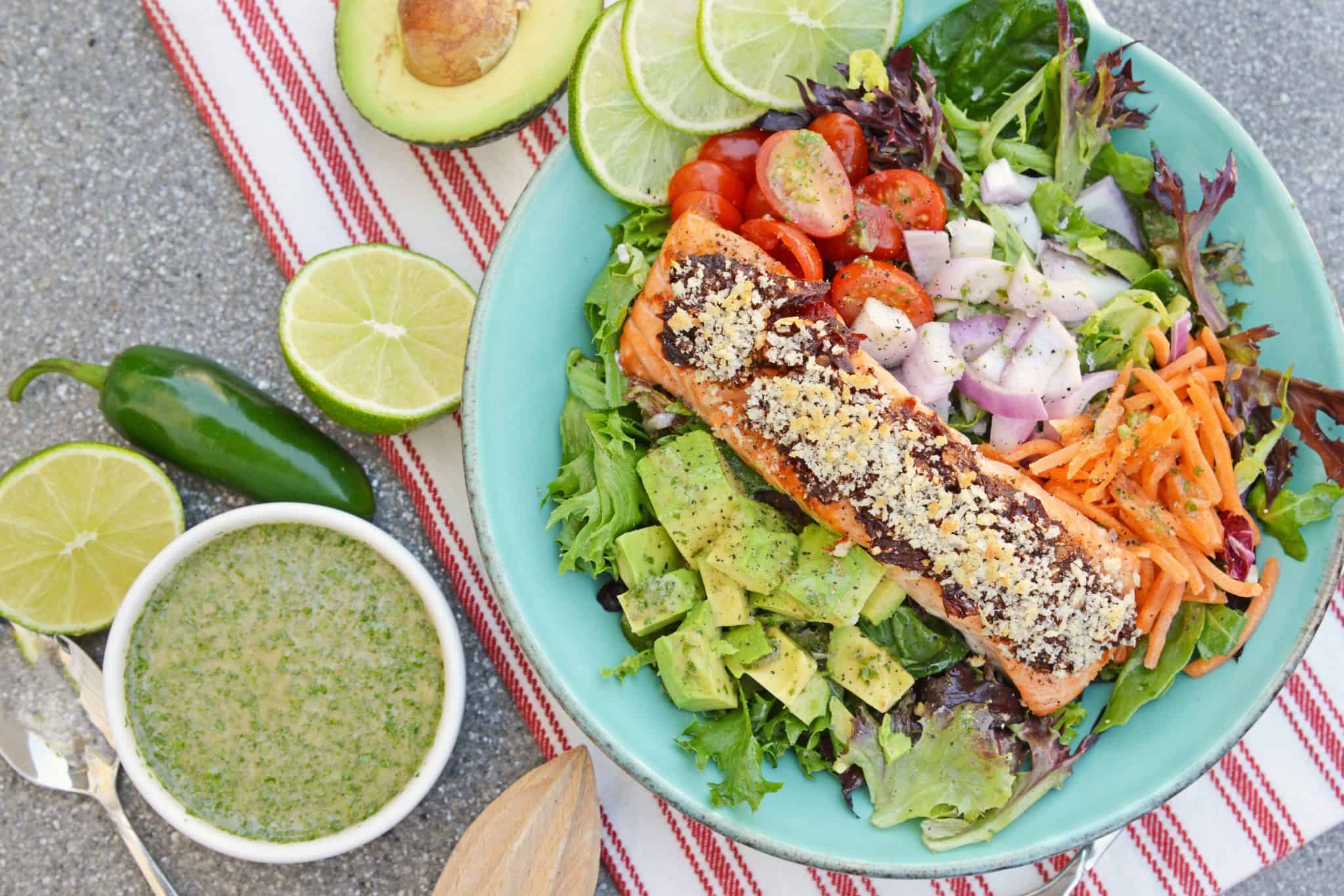 Crispy Chipotle Salmon Salad is a simple and healthy salad filled with a fun texture and spicy chipotle peppers. Top with Cilantro Lime Dressing. #salmonsaladrecipe #saladrecipes #bakedsalmonrecipe www.savoryexperiments.com