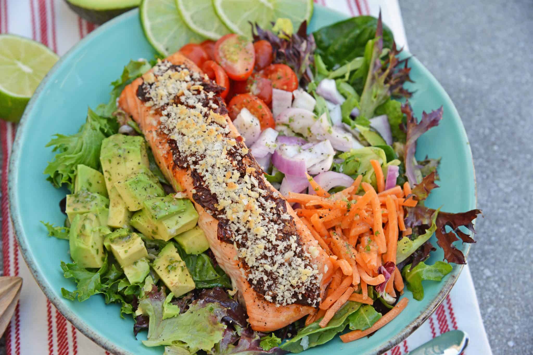 Crispy Chipotle Salmon Salad is a simple and healthy salad filled with a fun texture and spicy chipotle peppers. Top with Cilantro Lime Dressing. #salmonsaladrecipe #saladrecipes #bakedsalmonrecipe www.savoryexperiments.com