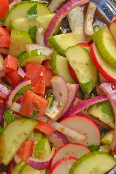 Fattoush Salad is of Arabic descent consisting of marinated vegetables, usually tomatoes and radishes, and tossed with grilled flatbread. #fattoushsalad www.savoryexperiments.com