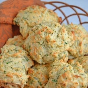 Cheese and Herb Biscuits are a delicious combination of fresh herbs, parmesan and mozzarella cheese! This recipe is perfect to enjoy as a side dish or a snack! #dropbiscuitrecipe #homemadebiscuits www.savoryexperiments.com