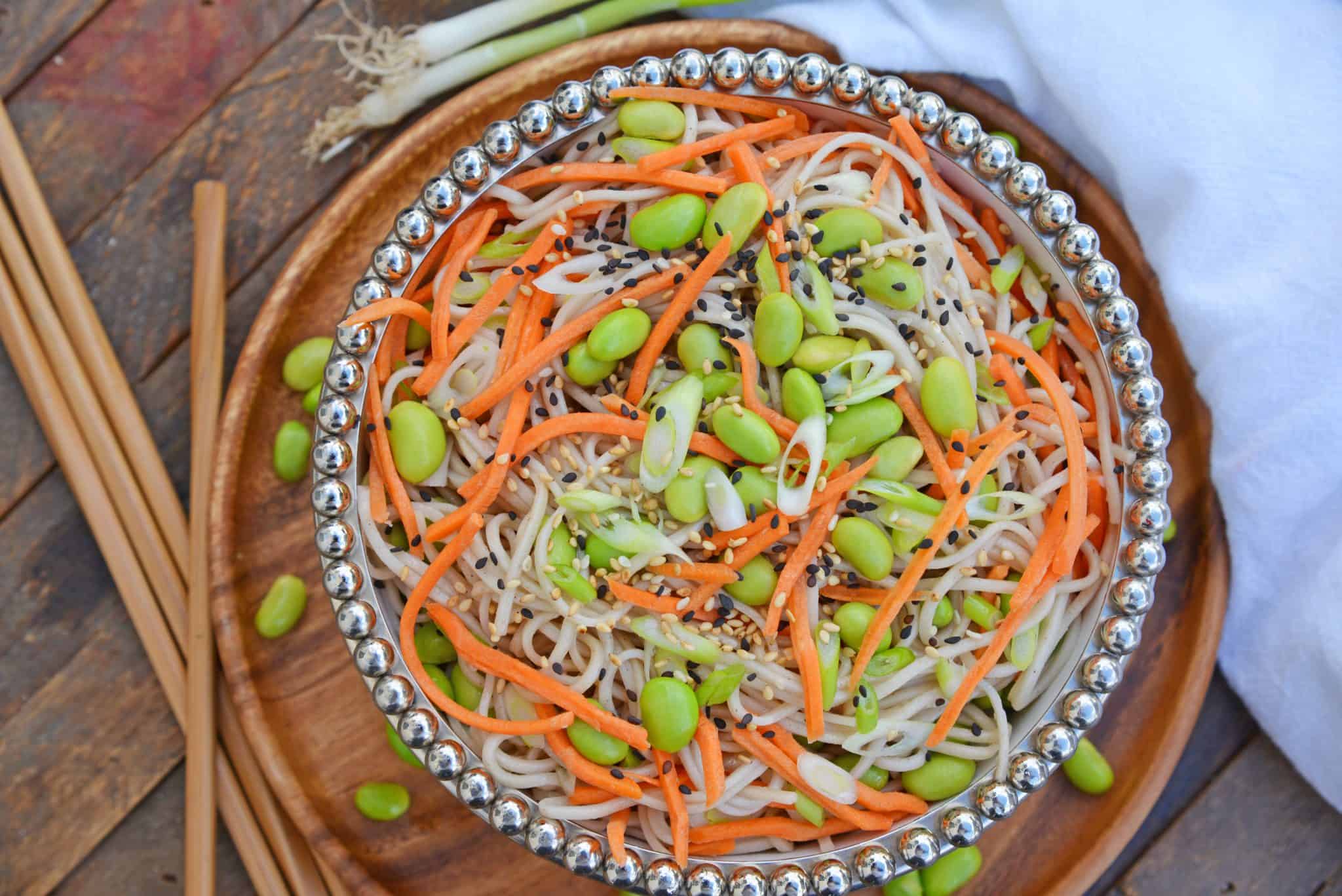 Sesame Soba Noodles are made from delicious buckwheat noodles tossed in a light Asian sauce, edamame, and carrots! This noodle salad is full of yummy flavors! #sobanoodlerecipe #whataresobanoodles? www.savoryexperiments.com