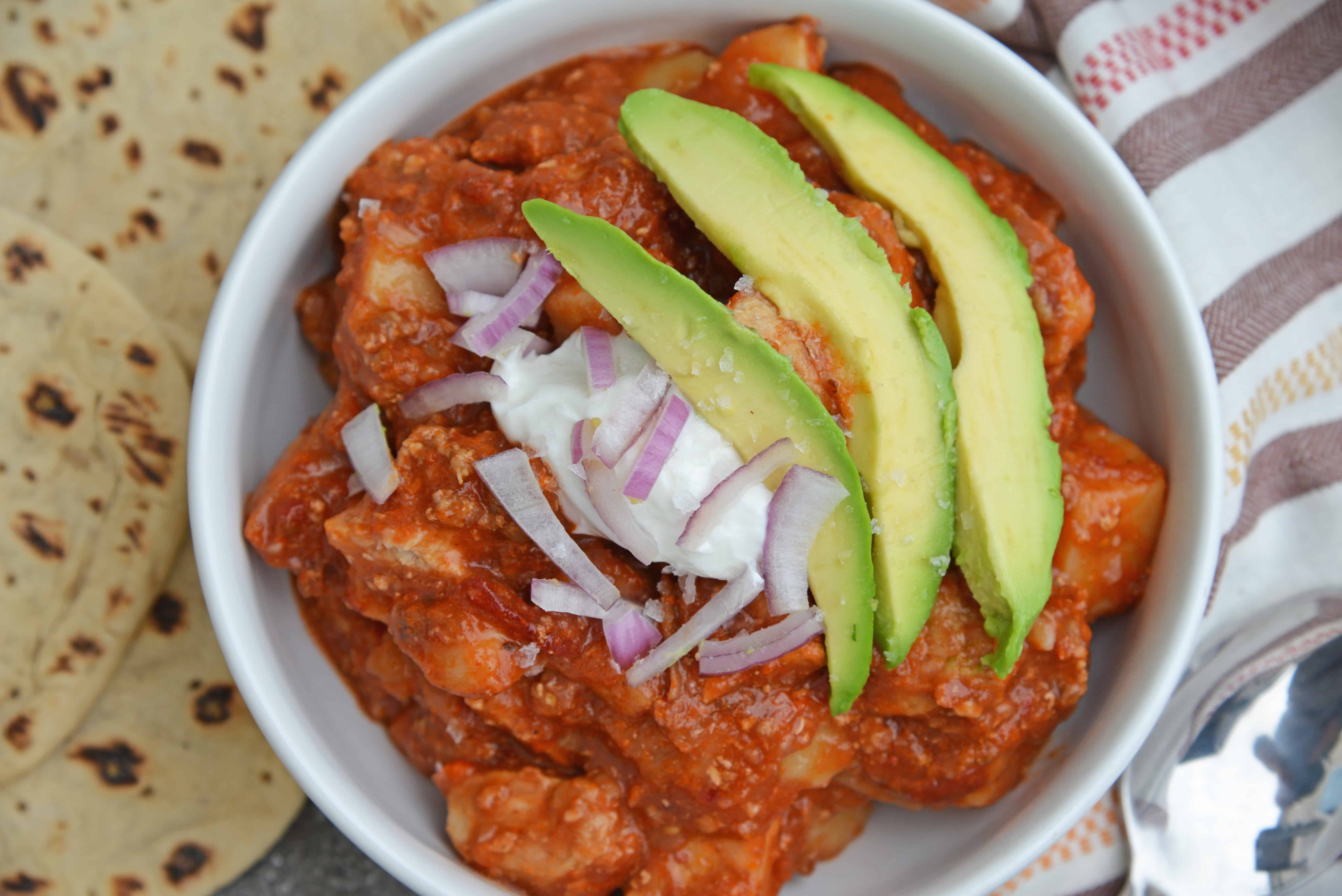 Spicy Pork and Potato Stew uses tender pork cuts and potato simmered in Middle Eastern spices and tomato sauce. Chipotle chiles in adobo sauce and chorizo bring loads of flavor. #porkstew #onepotmeals www.savoryexperiments.com 