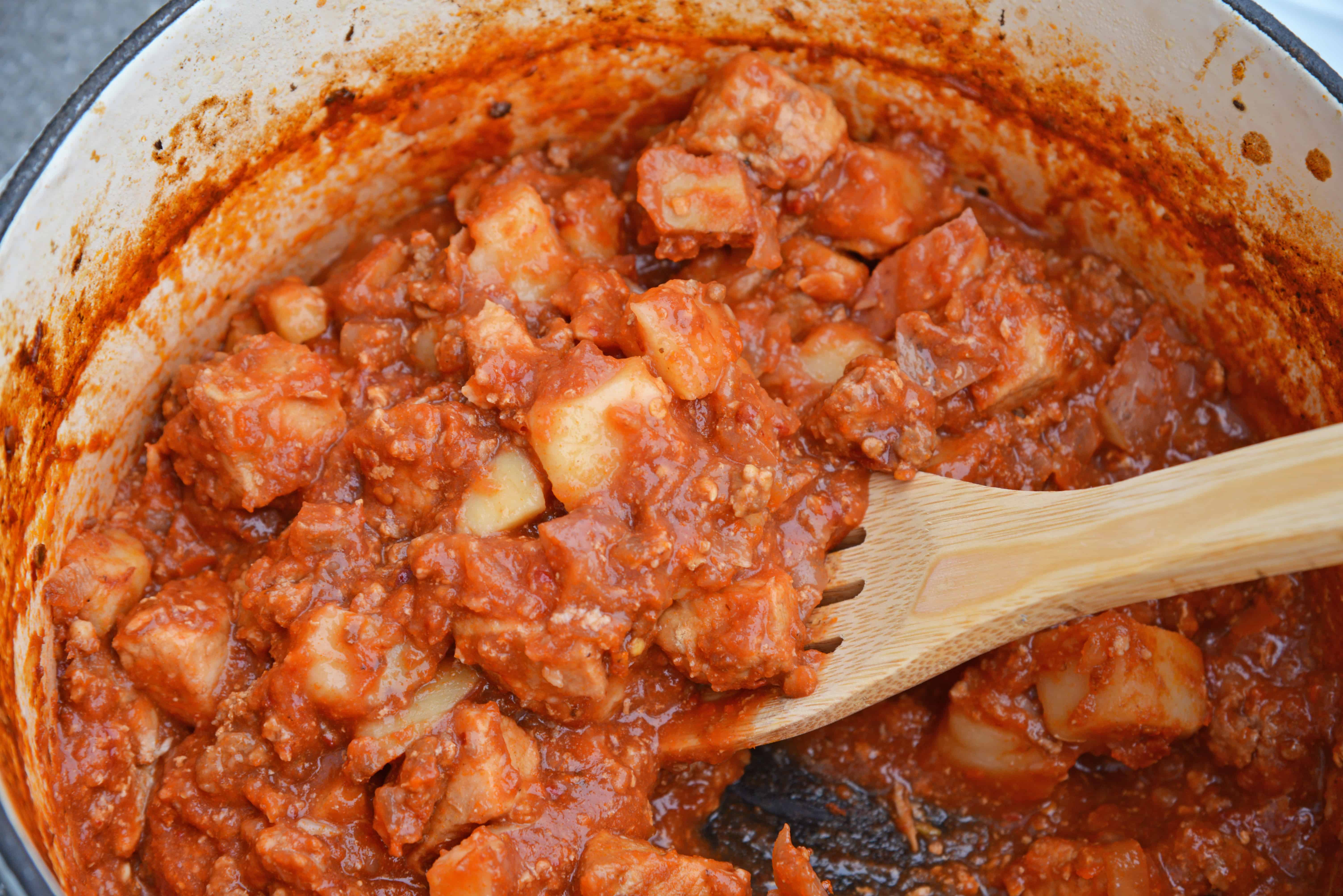 Spicy Pork and Potato Stew uses tender pork cuts and potato simmered in Middle Eastern spices and tomato sauce. Chipotle chiles in adobo sauce and chorizo bring loads of flavor. #porkstew #onepotmeals www.savoryexperiments.com 