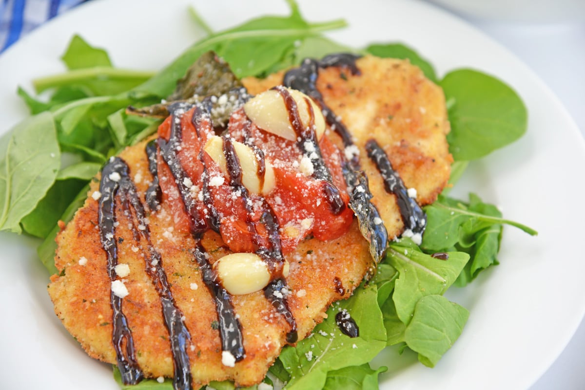 angle view of chicken cutlet with sauce