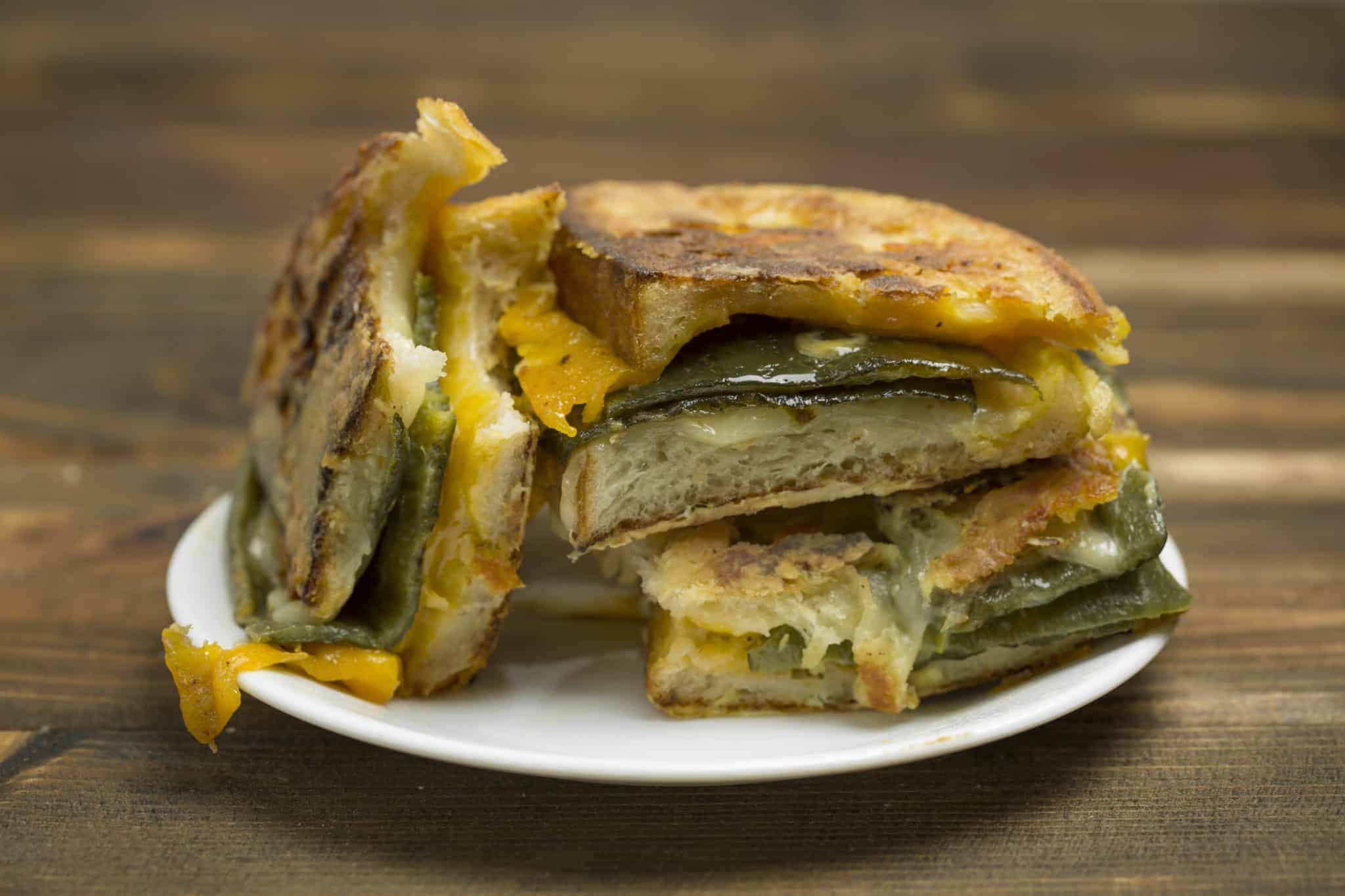 Chile Relleno Monte Cristo is a classic grilled cheese with pepper jack, cheddar and green chile and then battered and fried  Monte Cristo style. #montecristo #chilerelleno www.savoryexperiments.com 