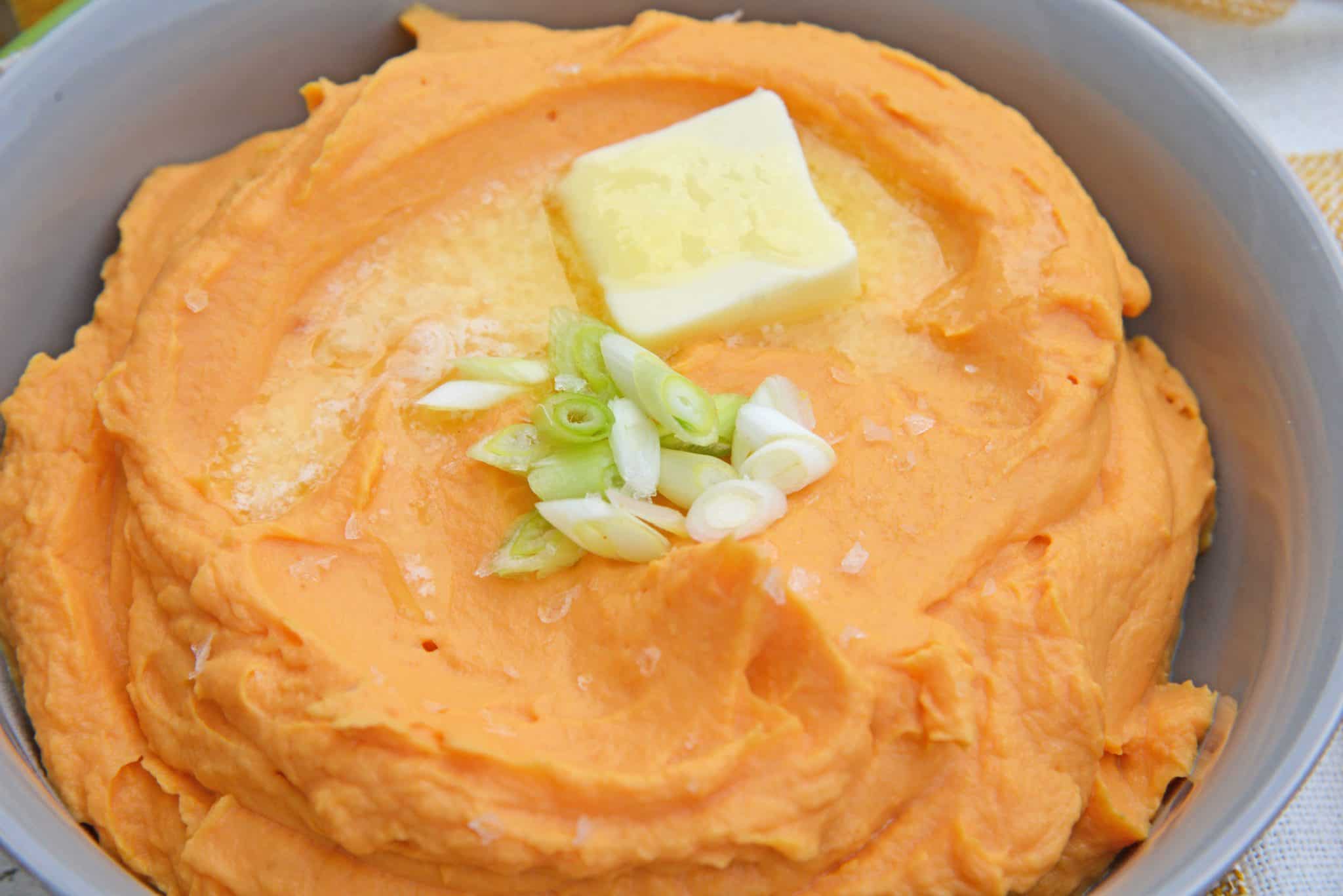 This Mashed Sweet Potatoes recipe uses baked sweet potatoes with natural sugars, bay leaf infused cream and a spike of orange juice for the best sweet potato mash ever! #sweetpotatomash #mashedsweetpotatoes www.savoryexperiments.com