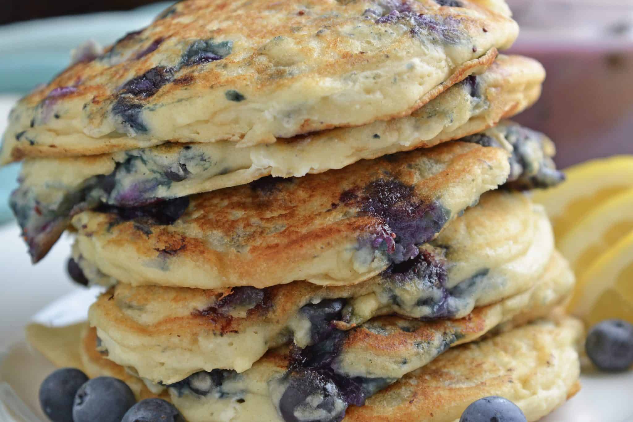 Blueberry Lemon Ricotta Pancakes! Make these easy blueberry pancakes with ricotta. Ricotta hotcakes are super fluffy pancakes. Best pancakes from scratch! #lemonricottapancakes #bestblueberrypancakes www.savoryexperiments.com