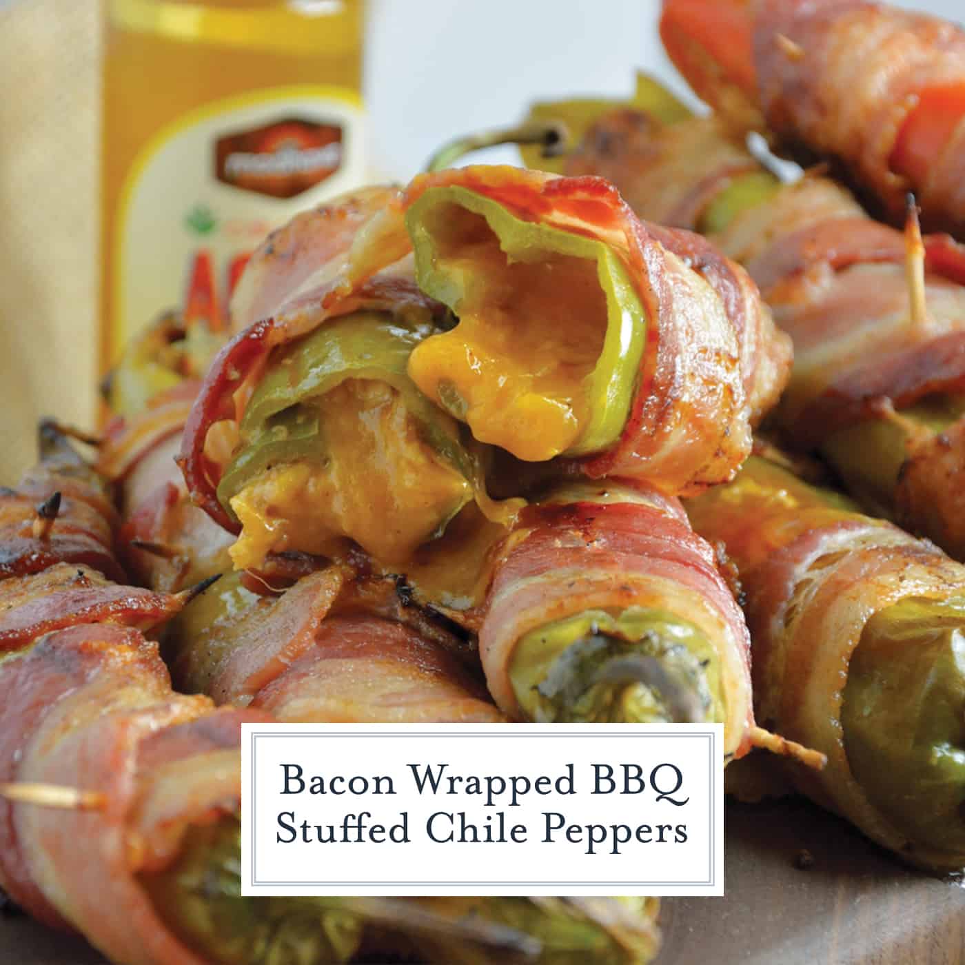 Bacon Wrapped BBQ Chicken Stuffed Chile Peppers are the ultimate BBQ Chicken recipe. Tender shredded chicken stuff in a chile pepper, wrapped in bacon and drizzled with sweet agave nectar. #BBQchicken #stuffedchilepeppers www.savoryexperiments.com