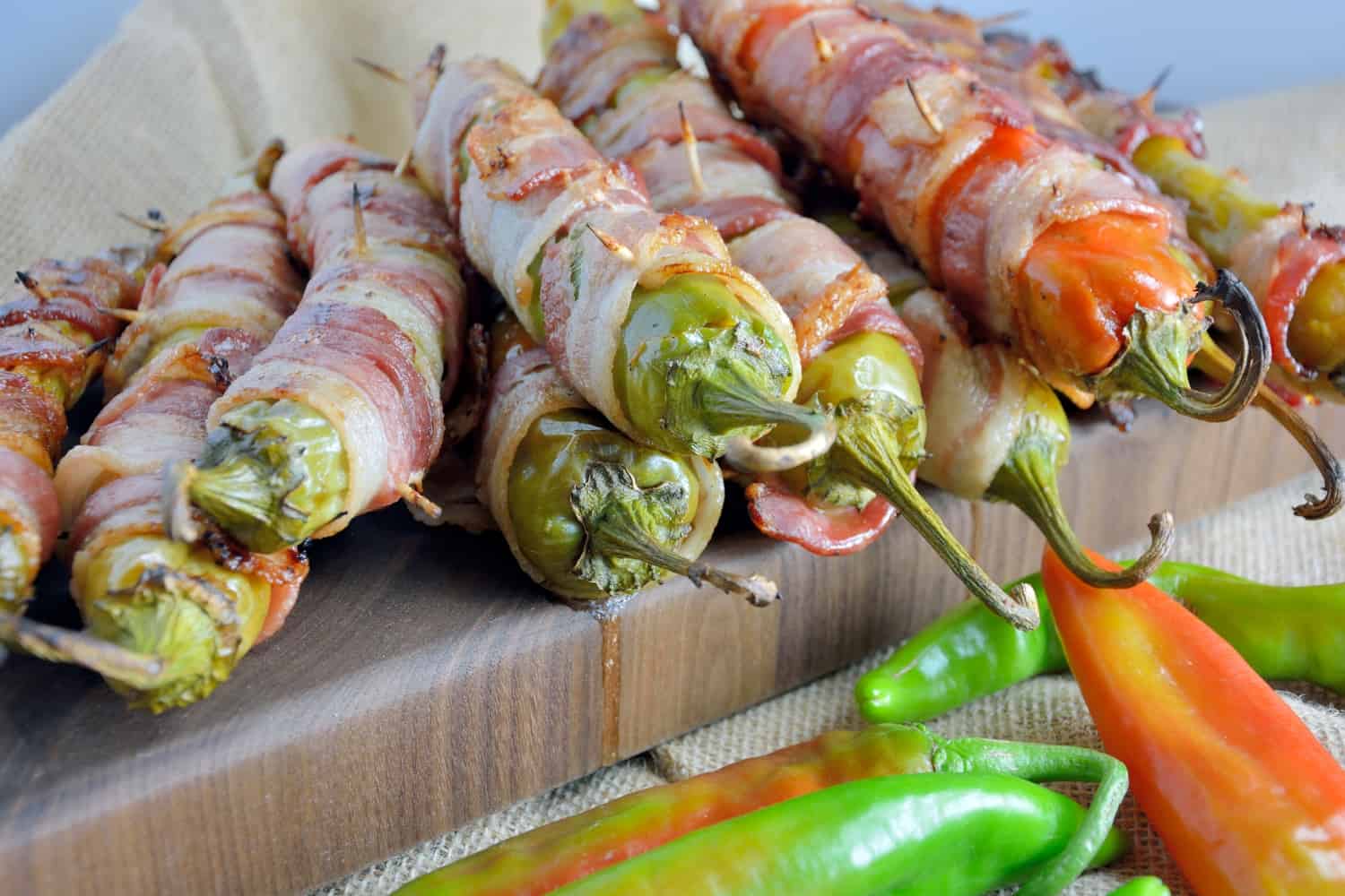 Bacon Wrapped BBQ Chicken Stuffed Chile Peppers Recipe- shredded chicken tossed in your choice of BBQ sauce and sharp cheddar cheese, stuffed into a large chile, wrapped in bacon and slow grilled. As seen on Fox News!