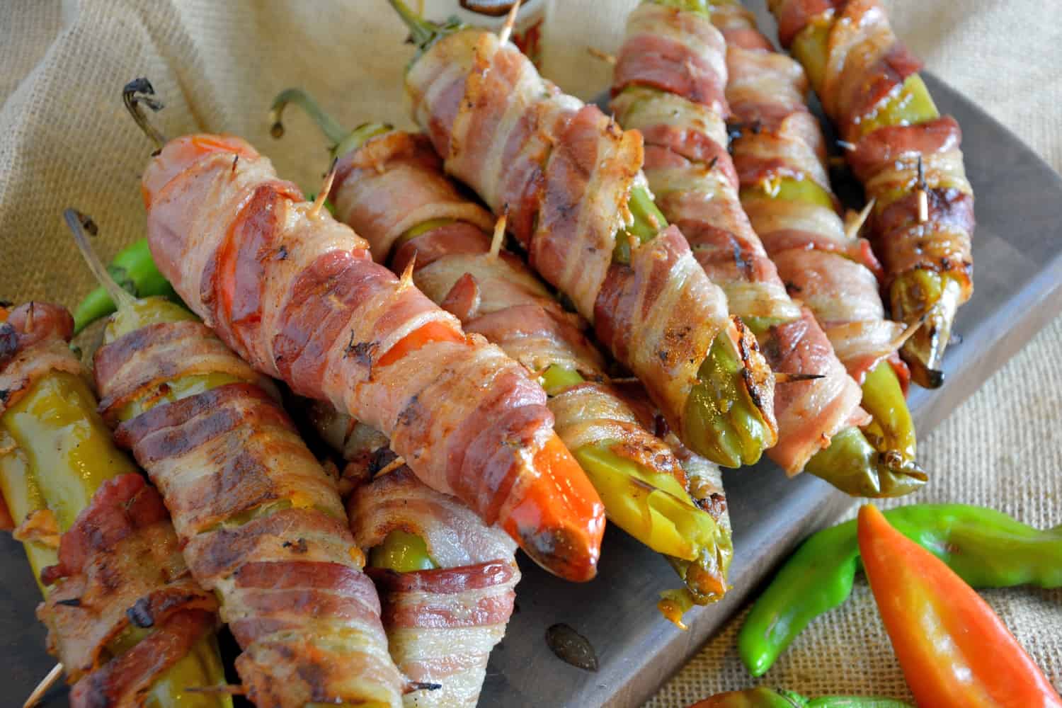 Bacon Wrapped BBQ Chicken Stuffed Chile Peppers Recipe- shredded chicken tossed in your choice of BBQ sauce and sharp cheddar cheese, stuffed into a large chile, wrapped in bacon and slow grilled. As seen on Fox News!