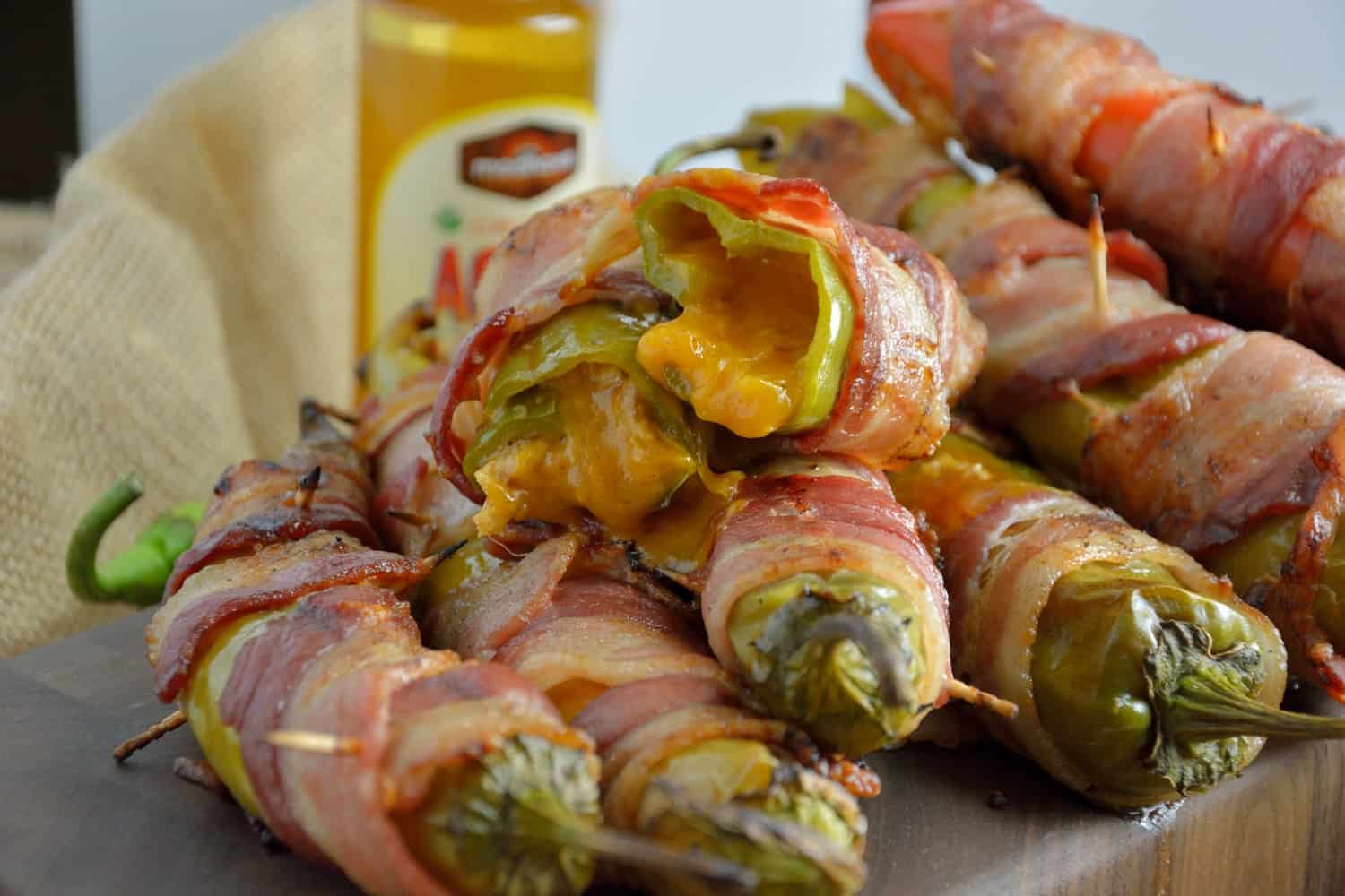 Bacon Wrapped BBQ Chicken Stuffed Chile Peppers Recipe- shredded chicken tossed in your choice of BBQ sauce and sharp cheddar cheese, stuffed into a large chile, wrapped in bacon and slow grilled. As seen on Fox News!
