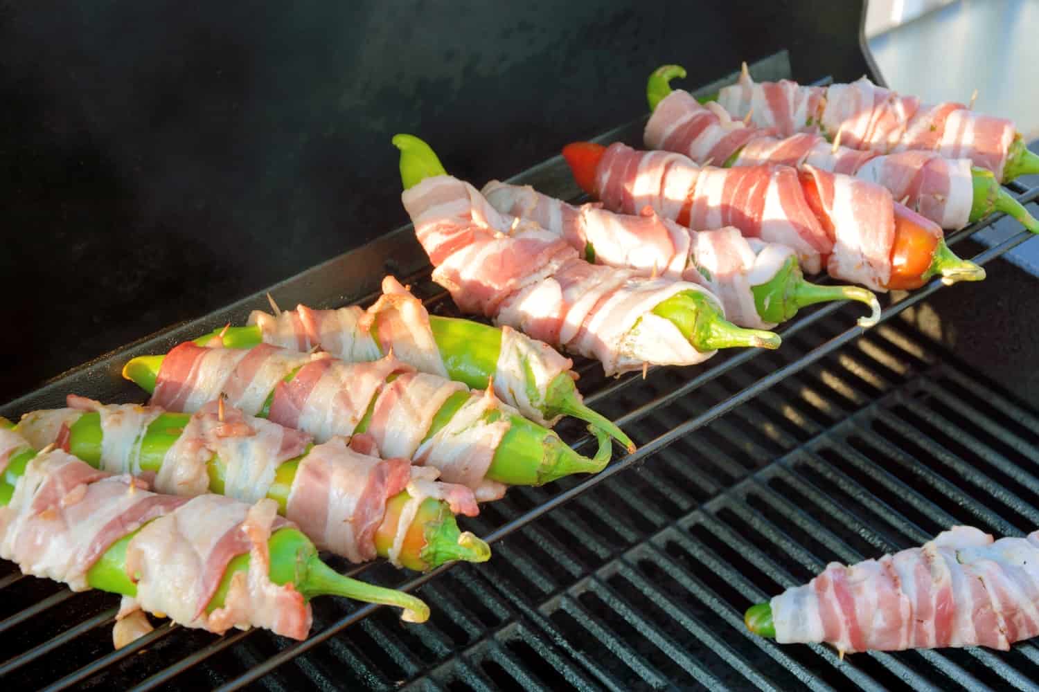 Bacon Wrapped BBQ Chicken Stuffed Chile Peppers Recipe- shredded chicken tossed in your choice of BBQ sauce and sharp cheddar cheese, stuffed into a large chile, wrapped in bacon and slow grilled. As seen on Fox News!