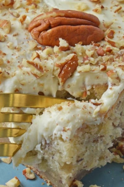 Super moist Banana Cake is a great way to use ripe bananas. Mix it with walnuts and top with a cream cheese frosting for a fabulous breakfast cake or fruity dessert. #bananacake www.savoryexperiments.com