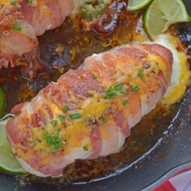Jalapeno Bacon Wrapped Chicken is a cheese stuffed chicken breast recipe using three cheeses and fresh jalapenos. Avocado and lime cool off the hot flavors. #baconwrappedchicken #jalapenopopperchicken www.savoryexperiments.com