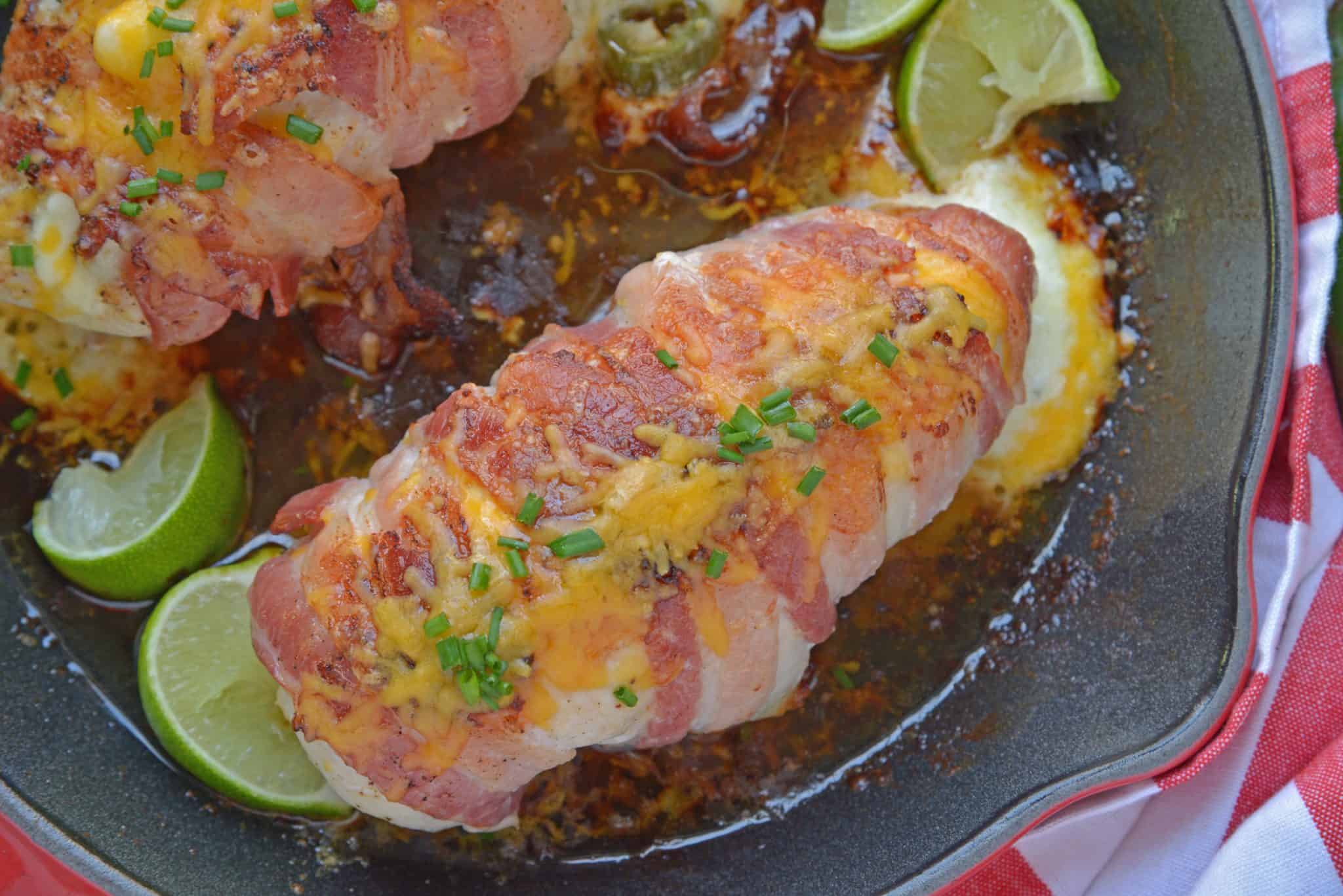 Jalapeno Bacon Wrapped Chicken is a cheese stuffed chicken breast recipe using three cheeses and fresh jalapenos. Avocado and lime cool off the hot flavors. #baconwrappedchicken #jalapenopopperchicken www.savoryexperiments.com