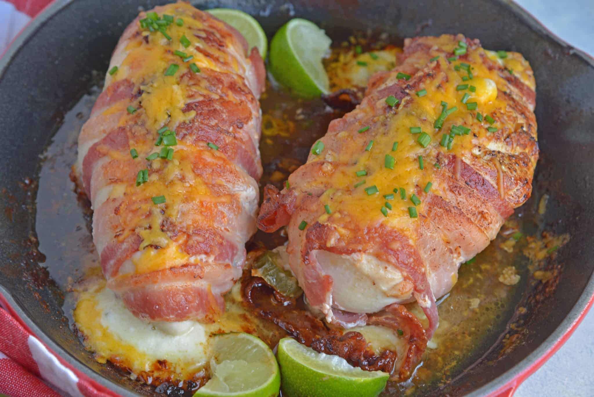 Jalapeno Bacon Wrapped Chicken is a cheese stuffed chicken breast recipe using three cheeses and fresh jalapenos. Avocado and lime cool off the hot flavors. #baconwrappedchicken #jalapenopopperchicken www.savoryexperiments.com