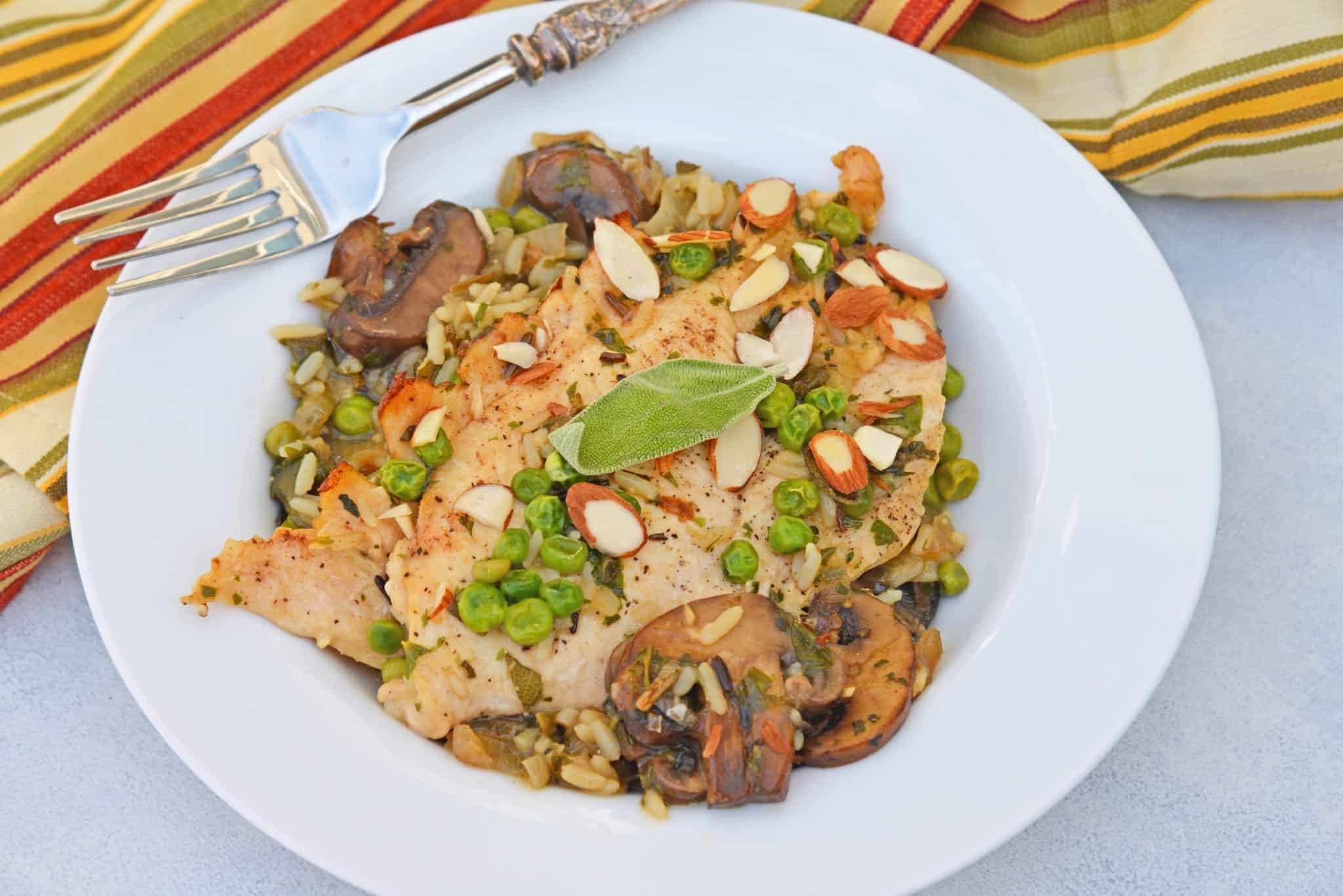 Mushroom Chicken and Rice Skillet is an easy one dish meal with loads of flavor like peas, mushrooms, shallots, sage and garlic. #onedishmeal #skilletmeal www.savoryexperiments.com
