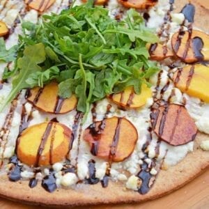 Peach Pizza is a delicious pizza variation that uses fresh peaches, melty mozzarella and gorgonzola cheeses and a sweet balsamic reduction sauce. The best homemade pizza recipe! #homemadepizzarecipe www.savoryexperiments.com