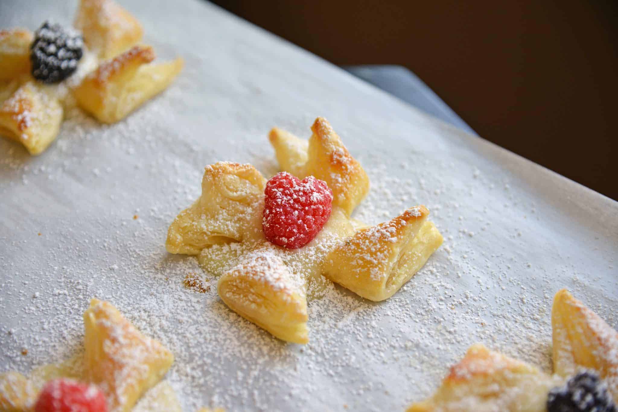Danish Pastry make a great dessert that is not heavy but is also easy and quick to put together. Everyone will love this brie in puff pastry! #puffpastrydesserts #brieinpuffpastry www.savoryexperiments.com