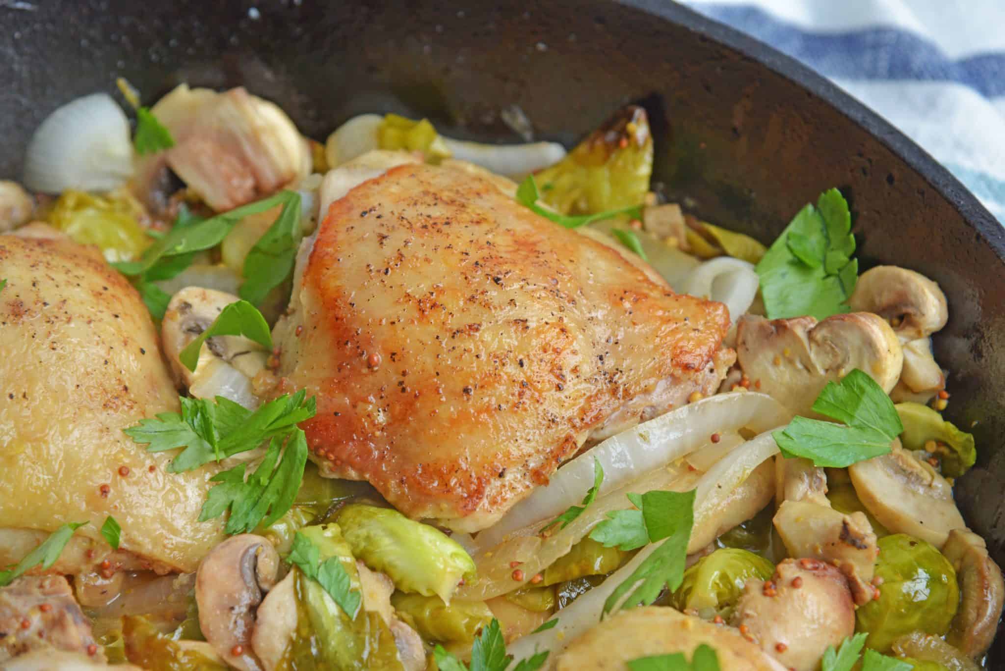 Chicken Dijon is an easy dinner recipe using chicken thighs, mushrooms, brussels sprouts, sweet onions, apple juice and of course, Dijon mustard! #chickendijon #mustardchicken #easychickenrecipe www.savoryexperiments.com 