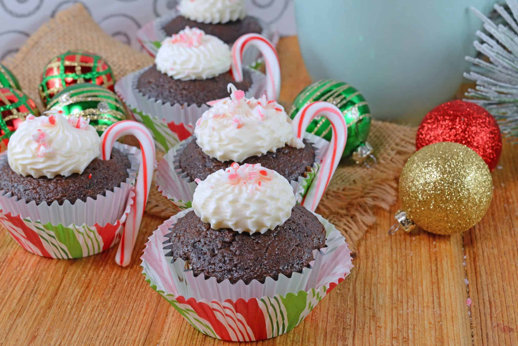 Peppermint Mocha Cupcakes use doctored up box mix, marshmallow creme frosting and candy canes for the ultimate kid-friendly cupcake recipe! #mochacupcakes #christmascupcakes www.savoryexperiments.com