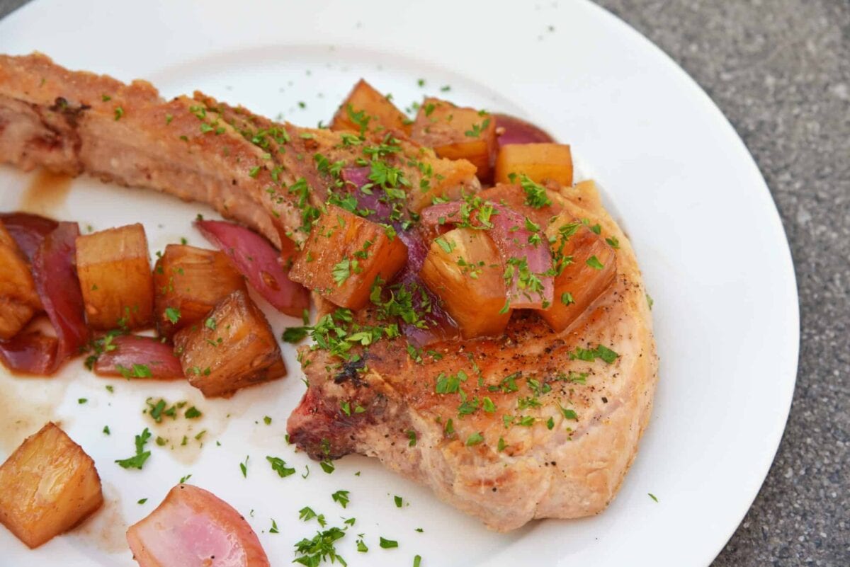 Pineapple Balsamic Pork Chops are a quick and easy meal that combine sweet balsamic vinegar and pineapple with garlic and onions for a well-balanced and easy meal! #porkchoprecipes #balsamicporkchops www.savoryexperiments.com