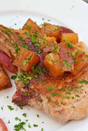 Pineapple Balsamic Pork Chops are a quick and easy meal that combine sweet balsamic vinegar and pineapple with garlic and onions for a well-balanced and easy meal! #porkchoprecipes #balsamicporkchops www.savoryexperiments.com