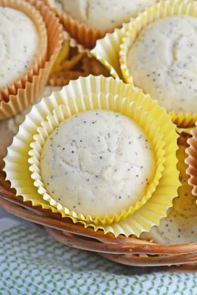Lemon Poppy Seed Muffins are a quick and easy muffin recipe that can be made in 30 minutes. Carbonated lemon water is the secret ingredient to make them super fluffy! #lemonmuffins #lemonpoppyseedmuffinsrecipe www.savoryexperiments.com