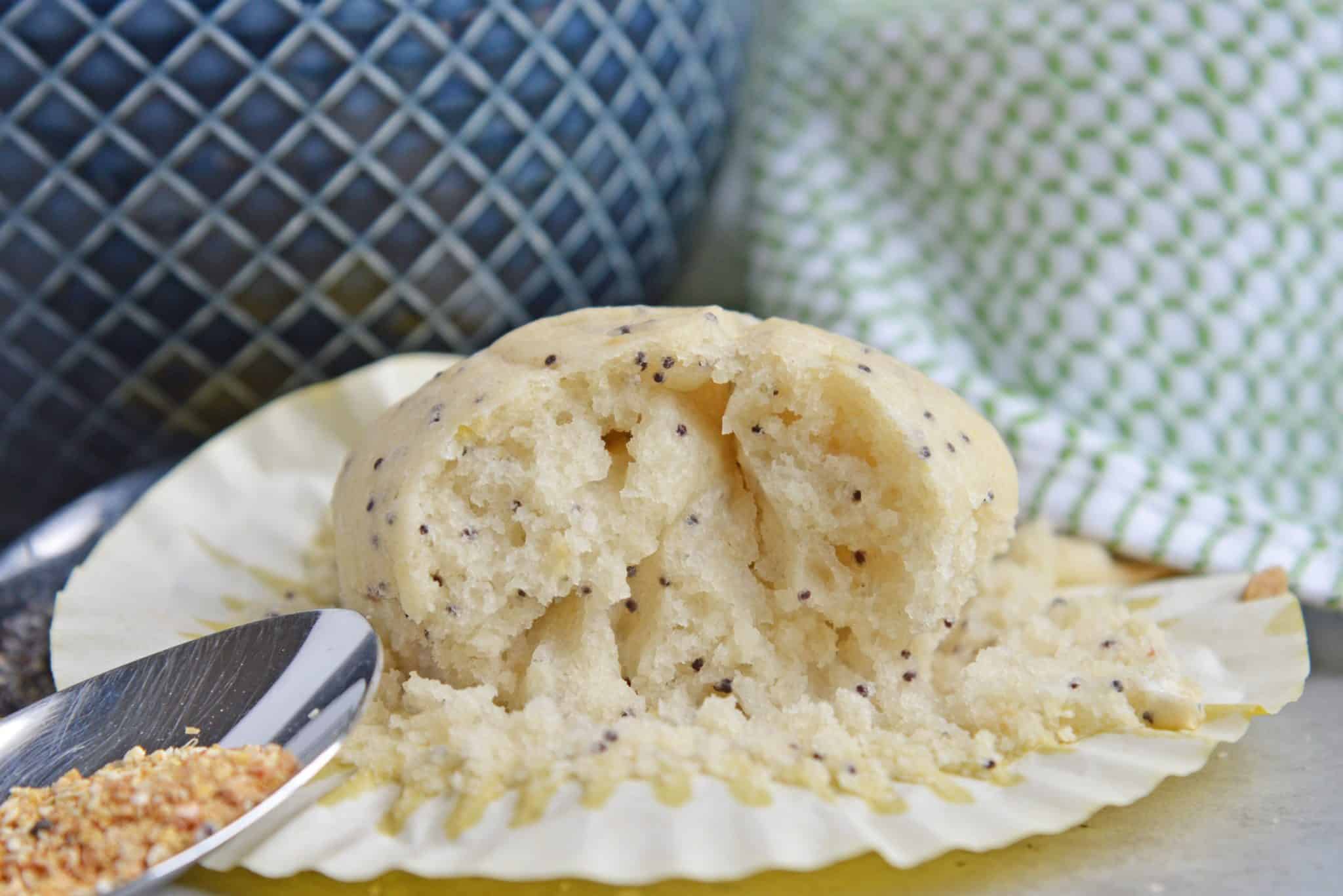 Lemon Poppy Seed Muffins are a quick and easy muffin recipe that can be made in 30 minutes. Carbonated lemon water is the secret ingredient to make them super fluffy! #lemonmuffins #lemonpoppyseedmuffinsrecipe www.savoryexperiments.com