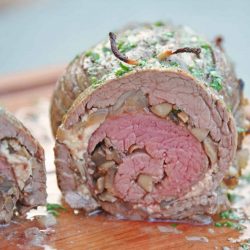 Mushroom Cheese Stuffed Flank Steak is a delicious and succulent main dish with cheese, mushrooms and garlic. The best flank steak pinwheel recipe! #stuffedflanksteak #flanksteakrecipe www.savoryexperiments.com