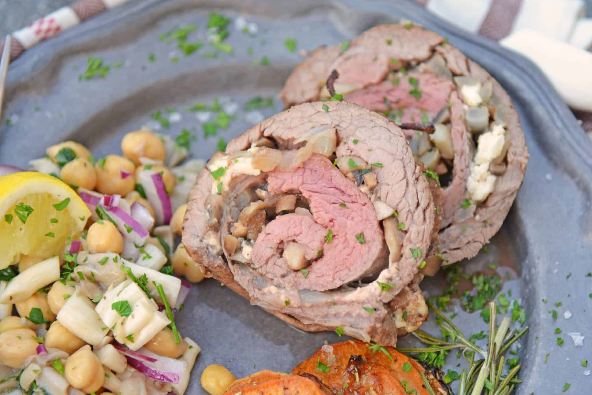 Mushroom Cheese Stuffed Flank Steak is a delicious and succulent main dish with cheese, mushrooms and garlic. The best flank steak pinwheel recipe! #stuffedflanksteak #flanksteakrecipe www.savoryexperiments.com