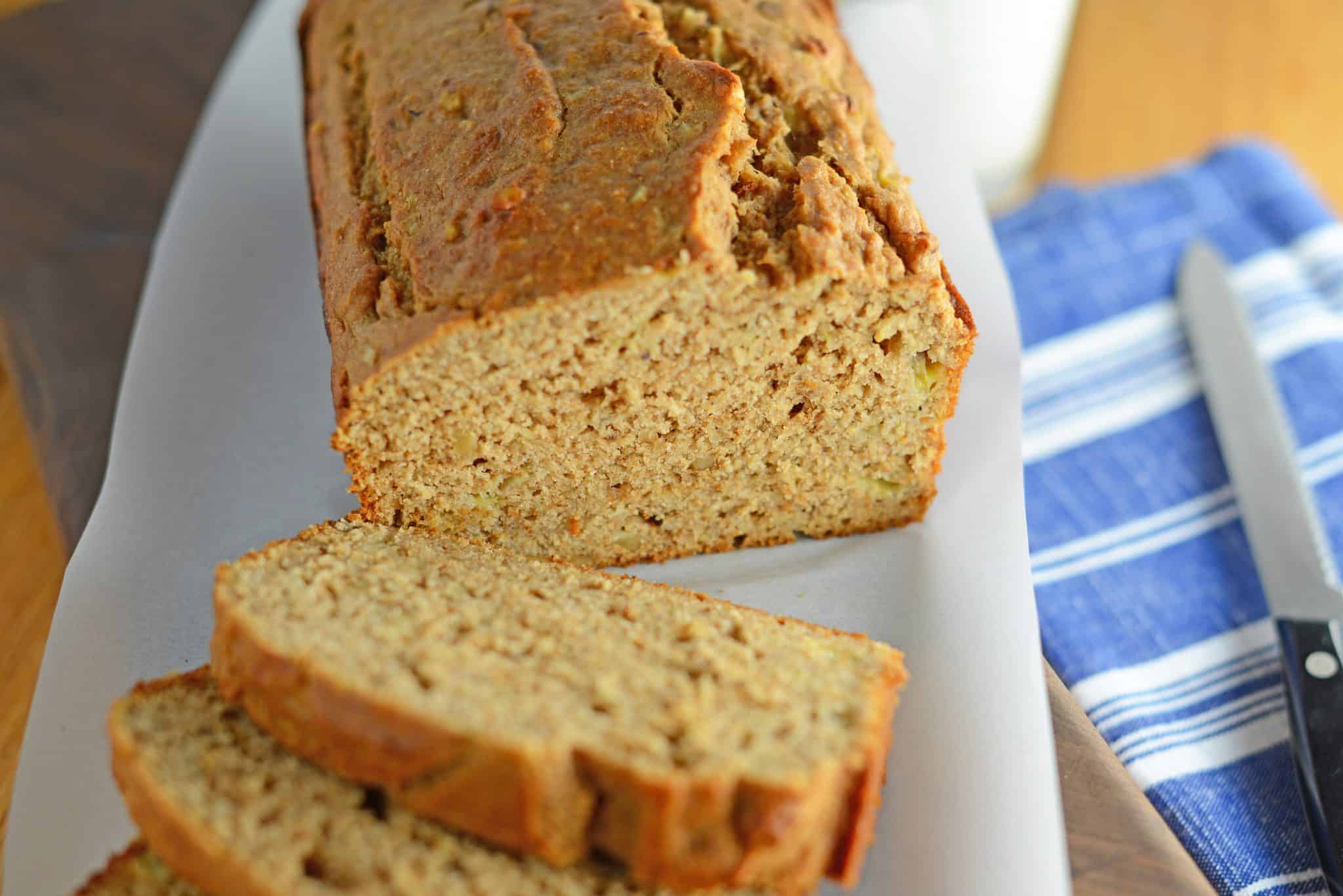 Whole Wheat Banana Bread is a healthier version of regular banana bread! Add pecans or walnuts for even more flavor! #wholewheatbananabread #bananabreadrecipe #bestbananabread www.savoryexperiments.com