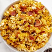 overhead of bacon caramel popcorn in a white serving bowl