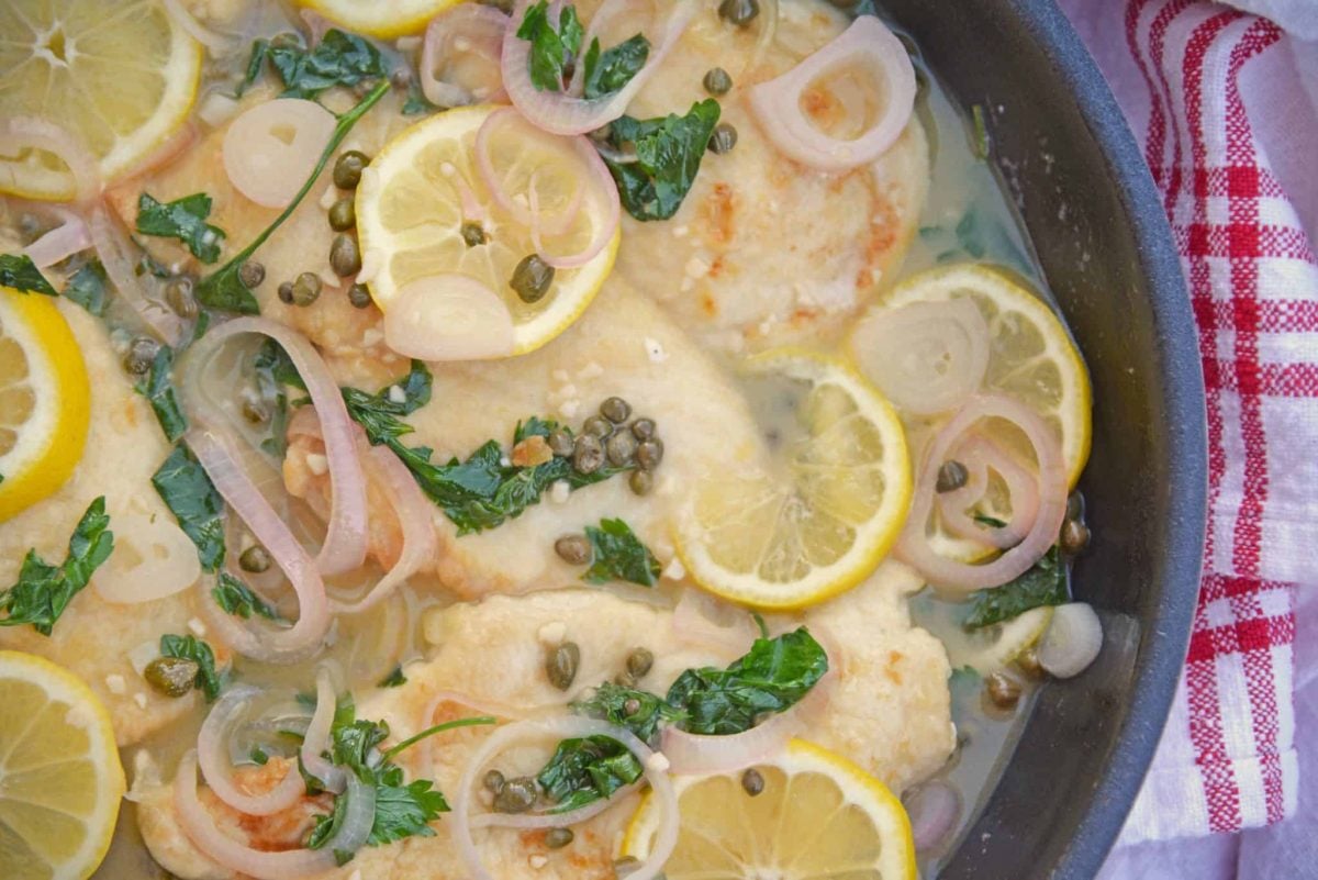 Classic Chicken Piccata is an easy Italian recipe that comes together in less than 3o minutes and explodes with flavors of lemon, caper and shallot. Delicious!  #chickenpiccata #easyitalianrecipes www.savoryexperiments.com